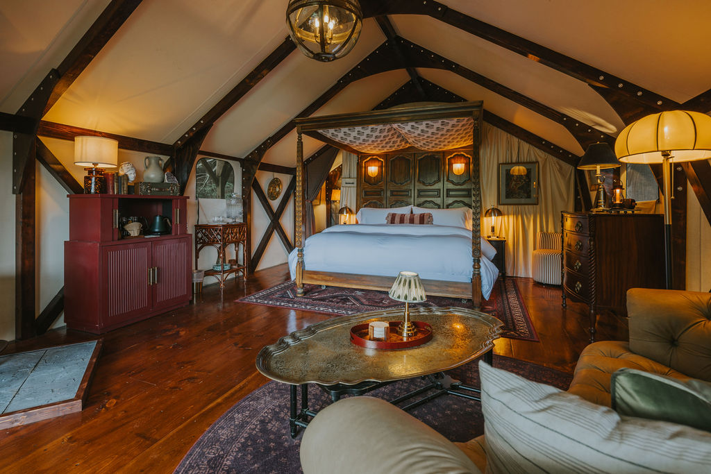 Wide view of the South Camp interior with bed and seating area