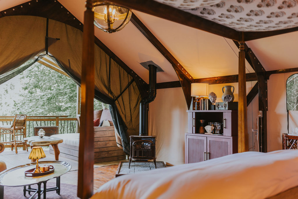Layered linens and pillows on the South Camp bed