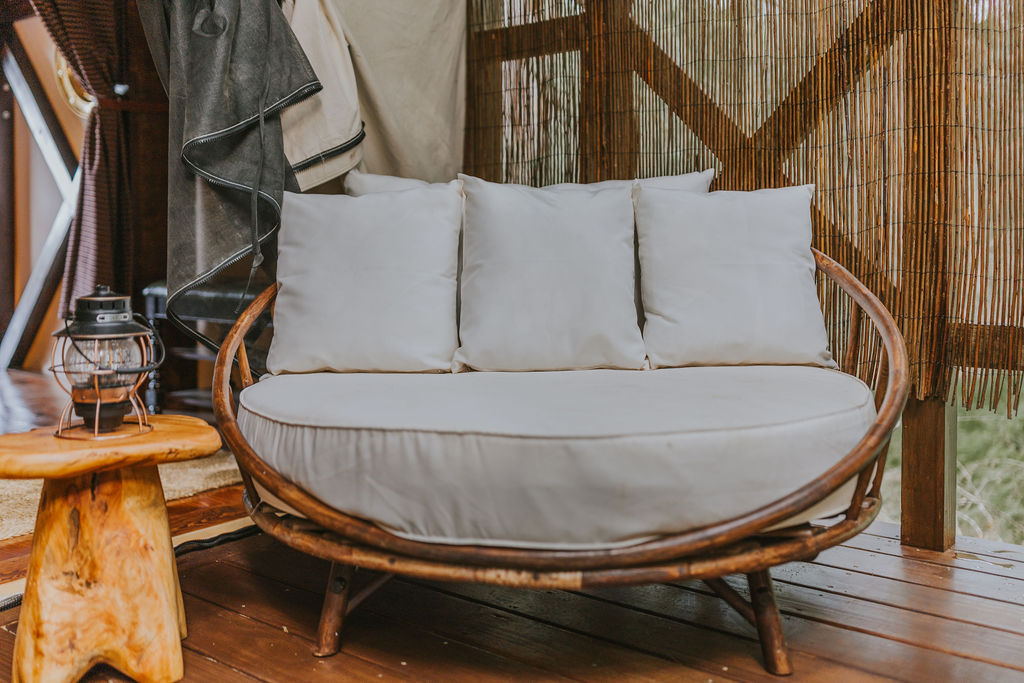 Cushioned daybed inside South Camp