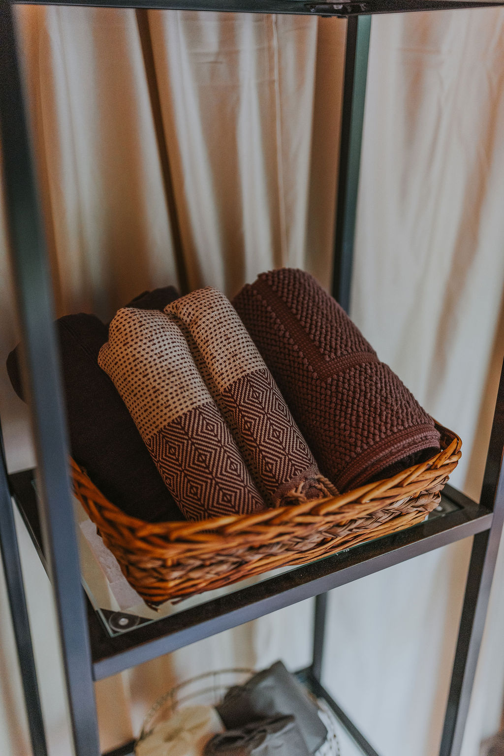 Rolled towels in a basket in South Camp
