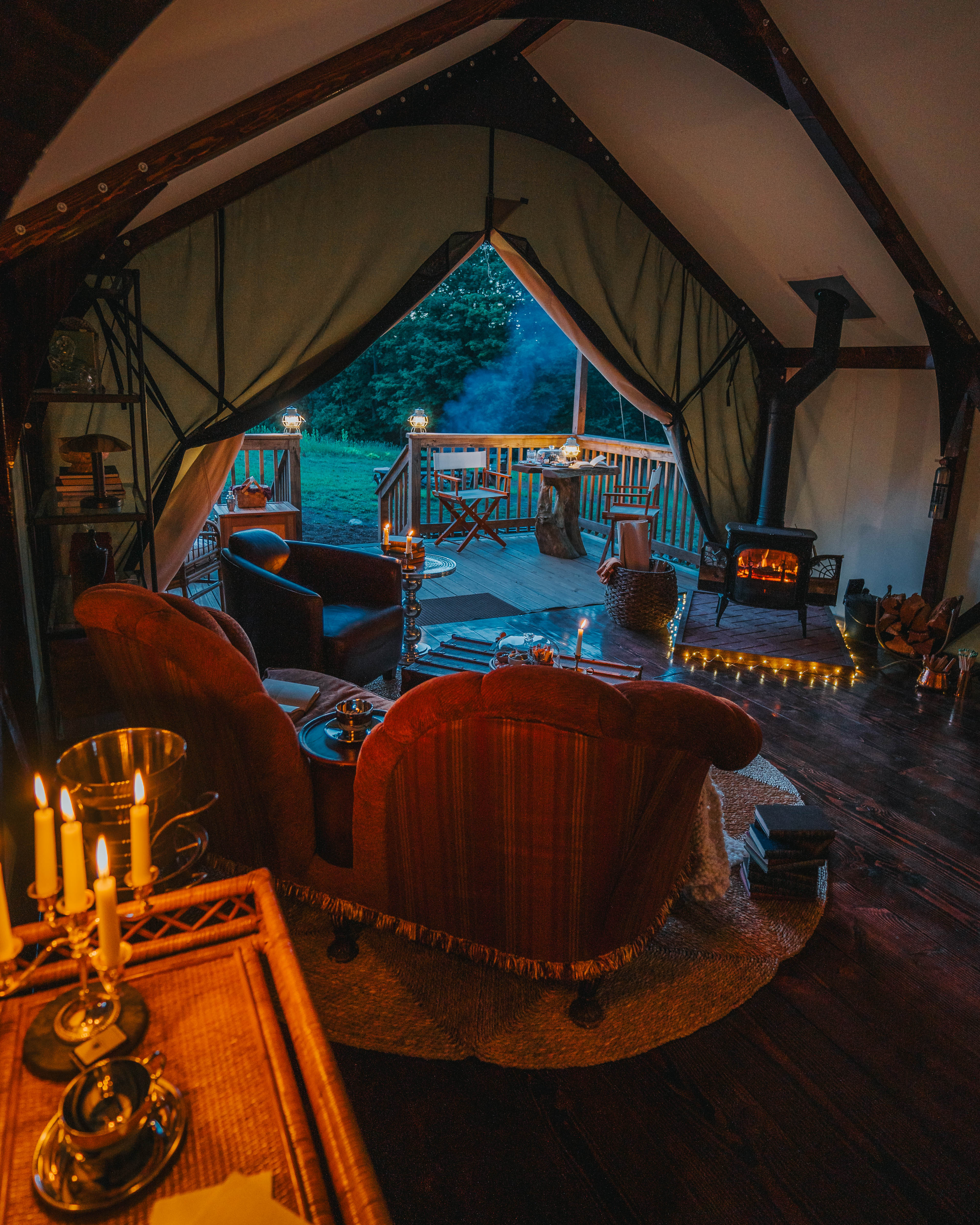 Luxurious tent interior with velvet chairs and candelabra