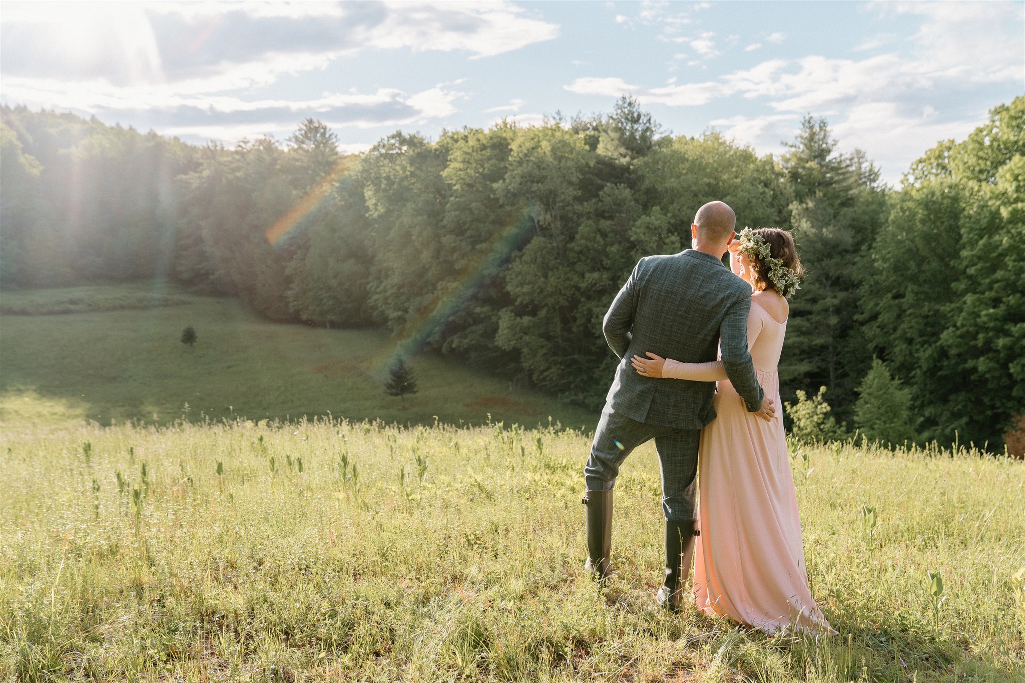 Couple looking out over the meadow at Highwood Retreat